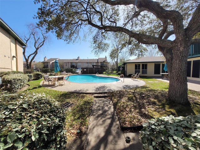 view of swimming pool featuring a patio and a fenced in pool