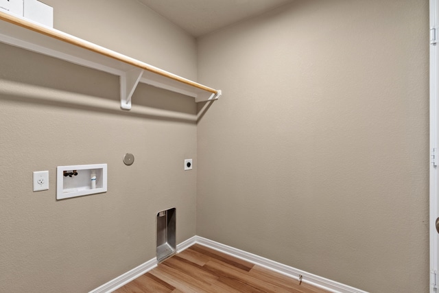 laundry room with electric dryer hookup, hookup for a washing machine, hookup for a gas dryer, and hardwood / wood-style floors