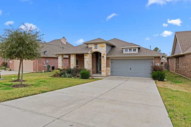 view of front facade with a front lawn and a garage