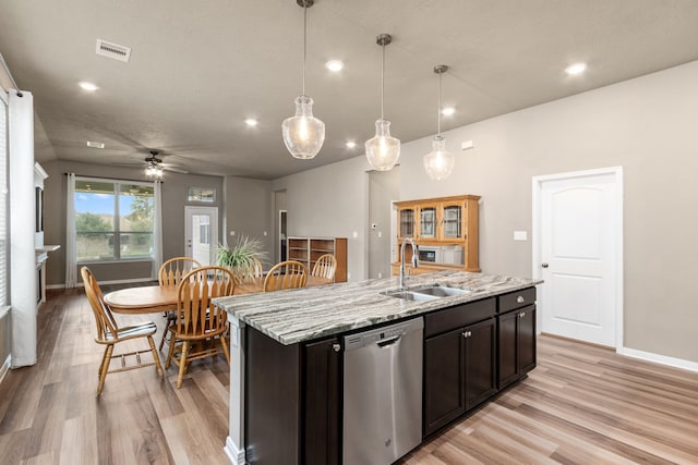 kitchen with sink, decorative light fixtures, ceiling fan, an island with sink, and stainless steel dishwasher