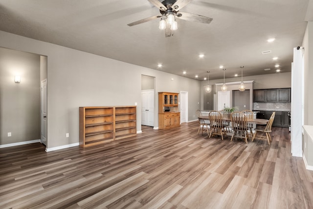 dining room featuring ceiling fan and dark hardwood / wood-style floors