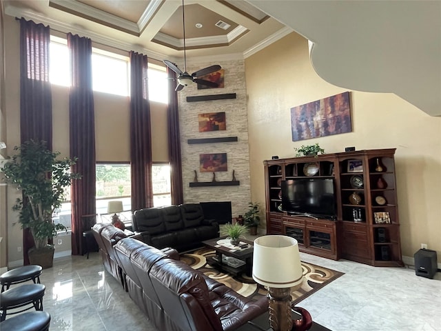 living room with crown molding, a towering ceiling, coffered ceiling, and a healthy amount of sunlight