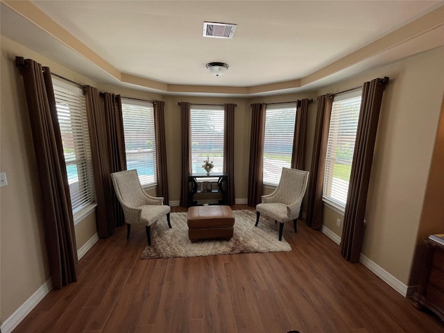 unfurnished room with a wealth of natural light and dark wood-type flooring