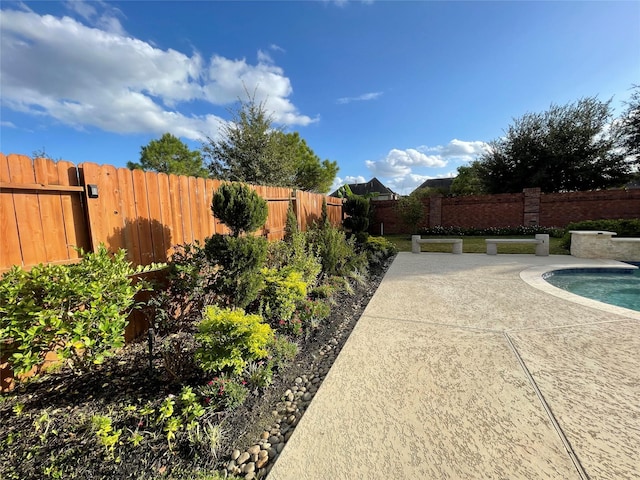 exterior space featuring a fenced in pool