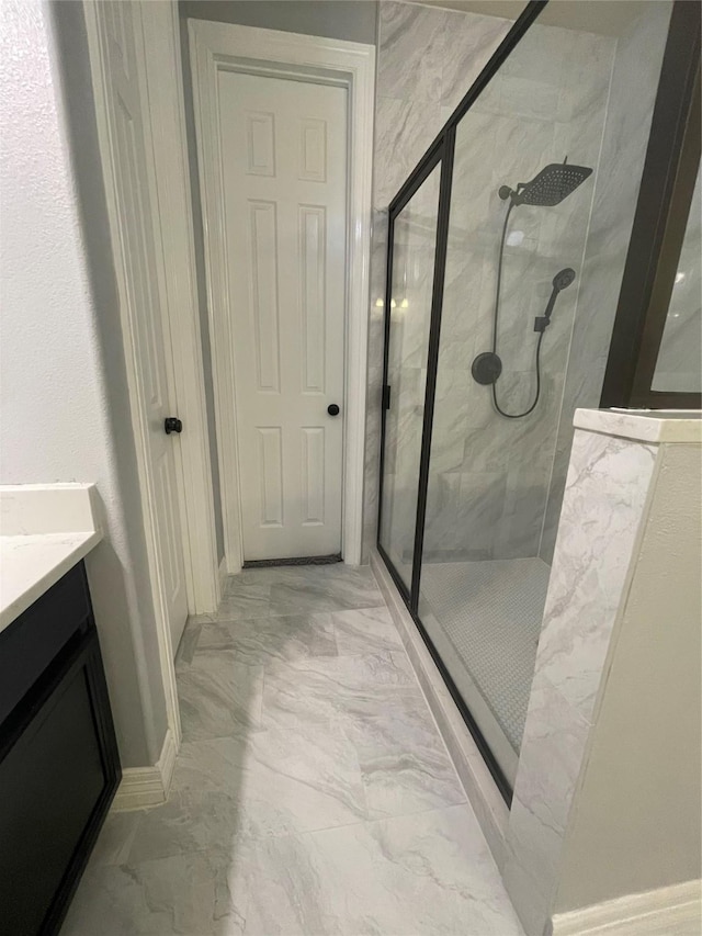 bathroom featuring vanity and walk in shower