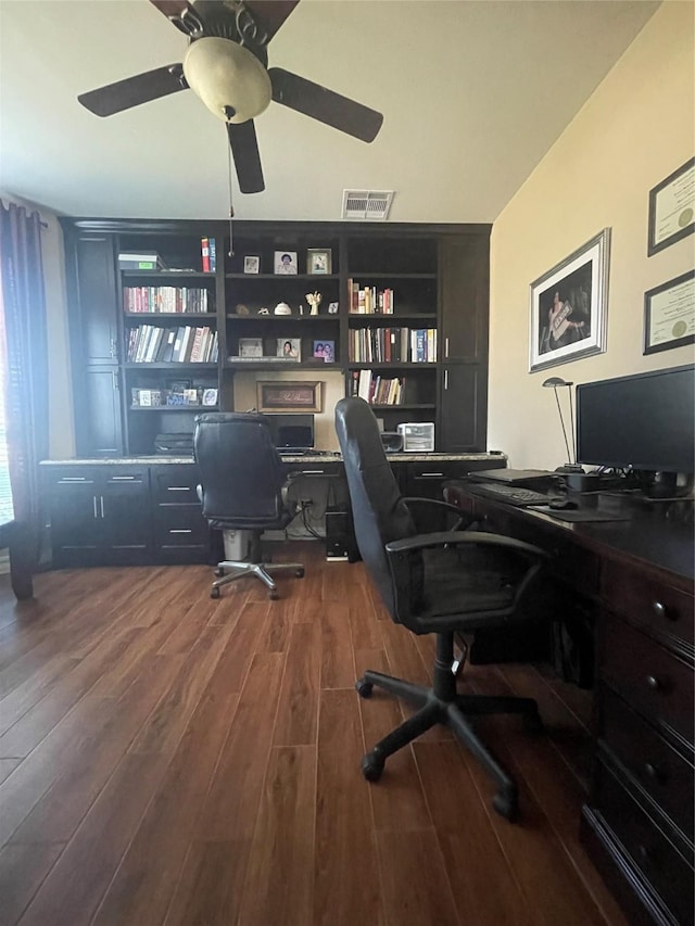 office area with ceiling fan and dark hardwood / wood-style floors