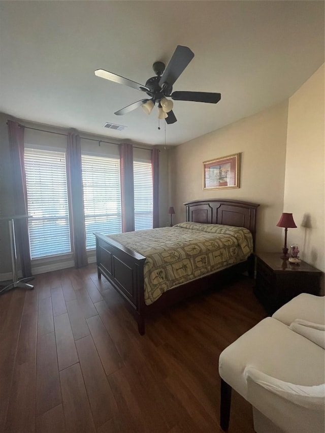 bedroom featuring ceiling fan and dark hardwood / wood-style flooring