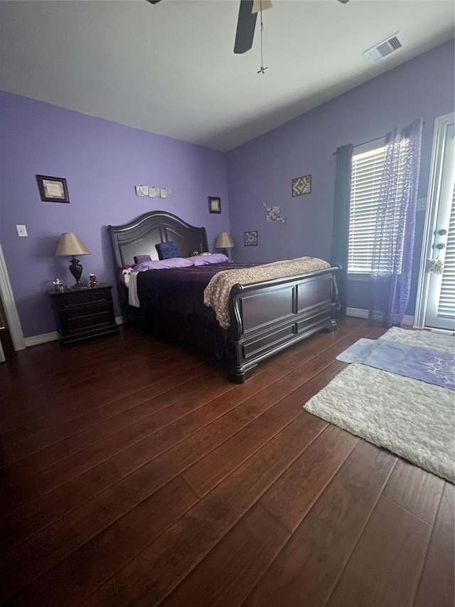 bedroom with dark wood-type flooring and ceiling fan