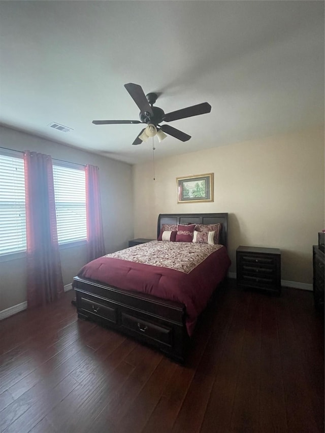 bedroom featuring dark hardwood / wood-style floors and ceiling fan