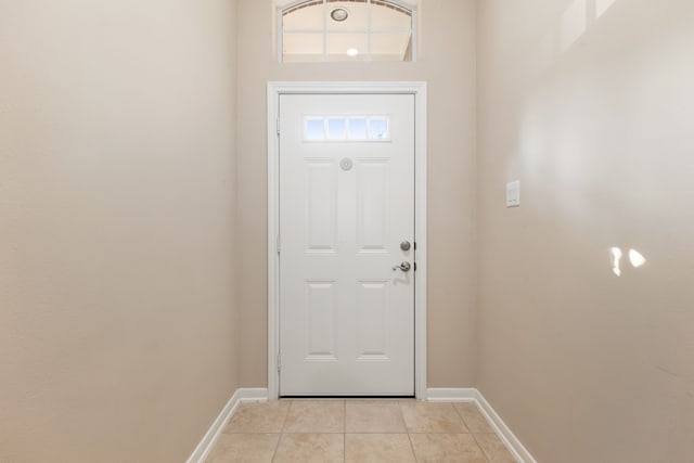 doorway featuring light tile patterned flooring