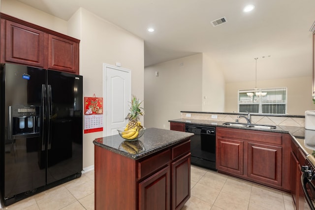 kitchen featuring sink, light tile patterned floors, a kitchen island, a chandelier, and black appliances