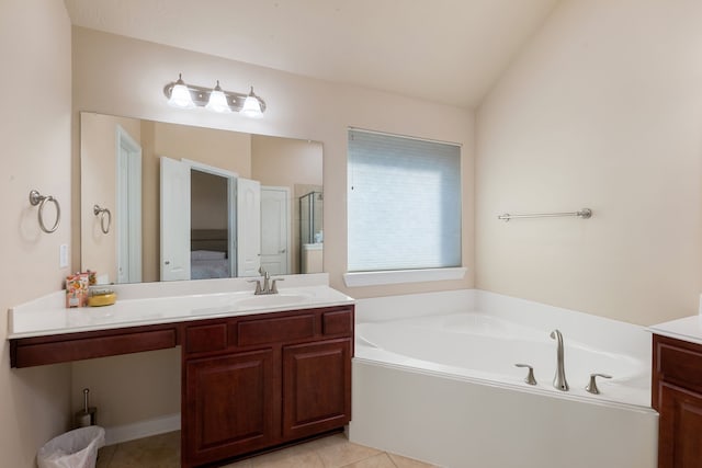 bathroom featuring separate shower and tub, vaulted ceiling, tile patterned floors, and vanity