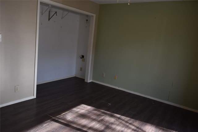 spare room featuring dark hardwood / wood-style floors