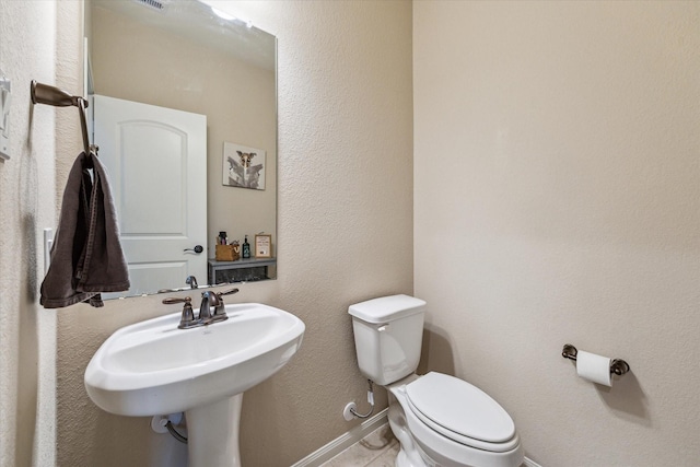 bathroom featuring toilet