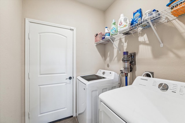 washroom with independent washer and dryer