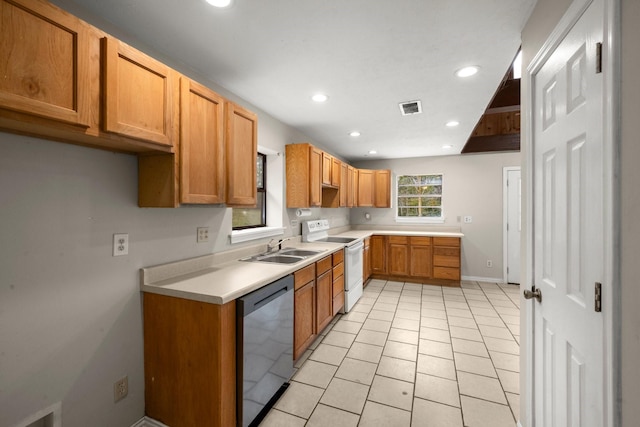 kitchen featuring dishwasher, light tile patterned floors, electric range, and sink