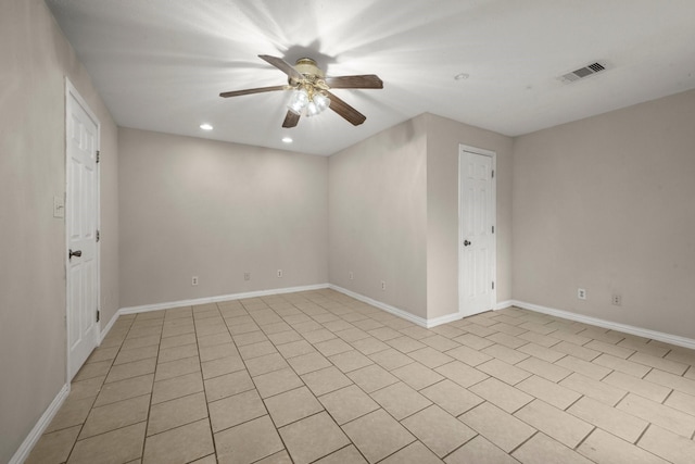 unfurnished room with ceiling fan and light tile patterned floors