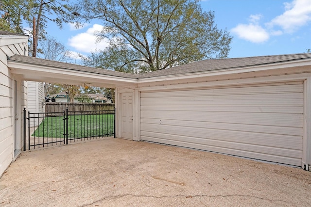 garage featuring a lawn