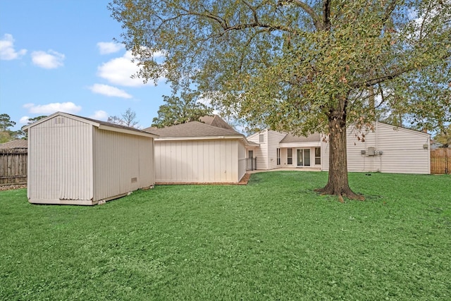 view of yard with a storage unit