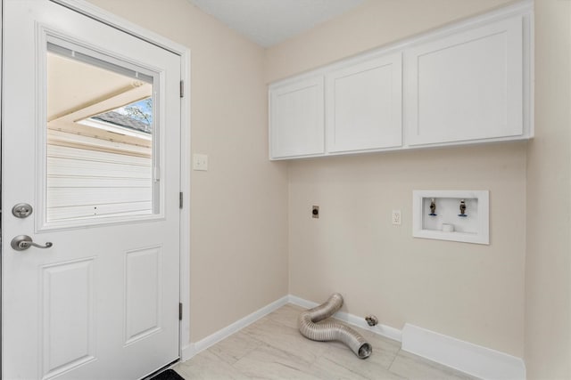 laundry area with cabinets, hookup for an electric dryer, and hookup for a washing machine