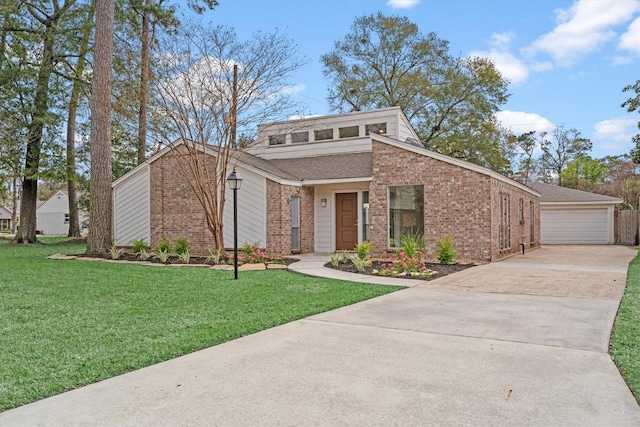 view of front facade with a front yard and a garage