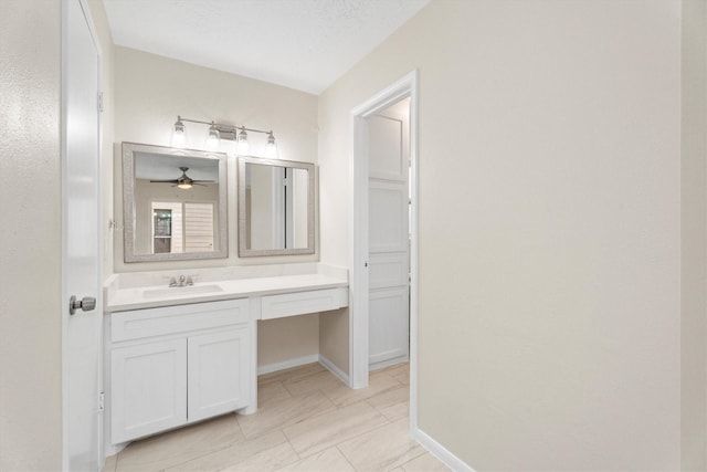 bathroom featuring vanity, a textured ceiling, and ceiling fan