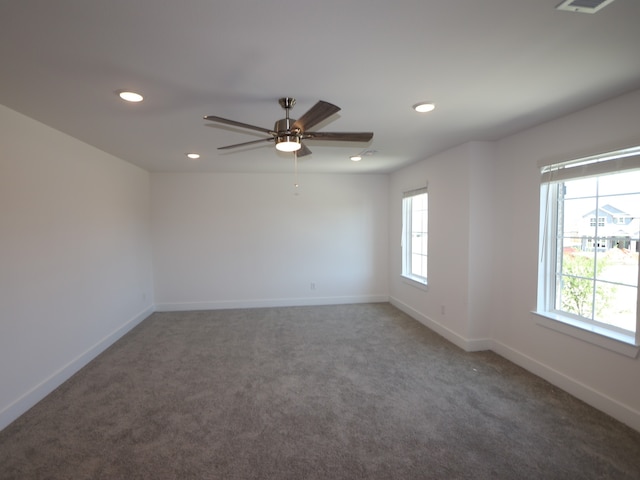spare room with carpet, baseboards, ceiling fan, and recessed lighting