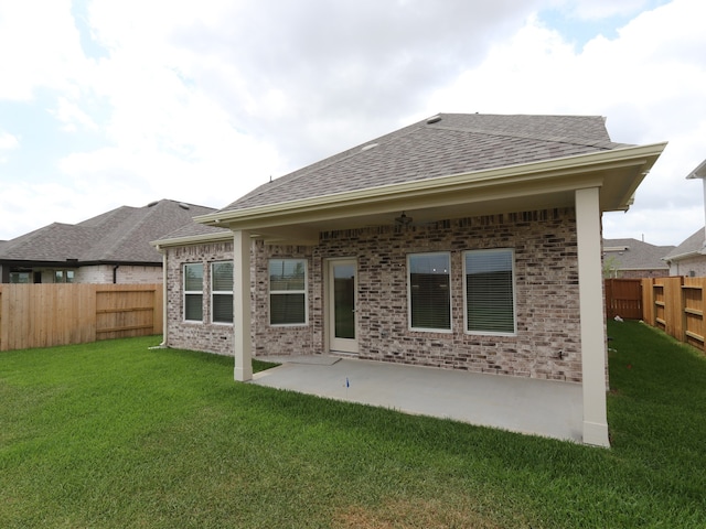 21734 Persian Lake Dr, Cypress, TX 77433 - back of house with roof with shingles, a patio, and brick siding