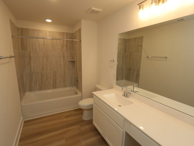 21734 Persian Lake Dr, Cypress, TX 77433 - bathroom with toilet, vanity, wood finished floors, recessed lighting, and bathing tub / shower combination
