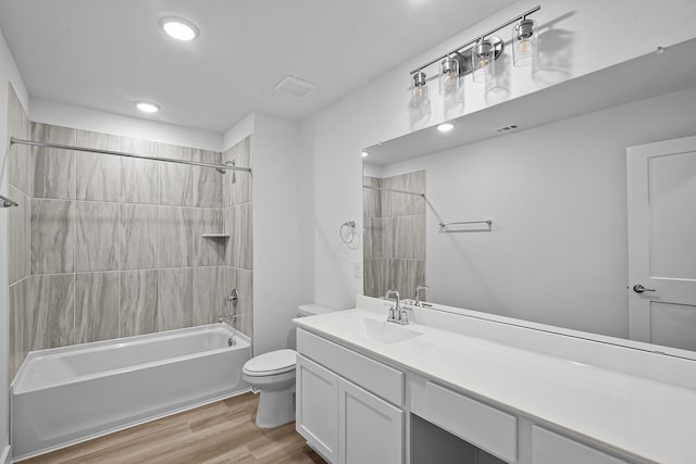 21734 Persian Lake Dr, Cypress, TX 77433 - full bath featuring toilet, shower / bathtub combination, vanity, wood finished floors, and recessed lighting