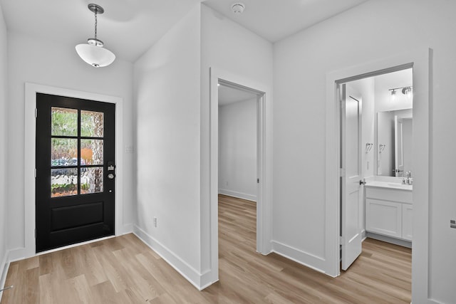 21734 Persian Lake Dr, Cypress, TX 77433 - foyer entrance with light wood-style flooring and baseboards