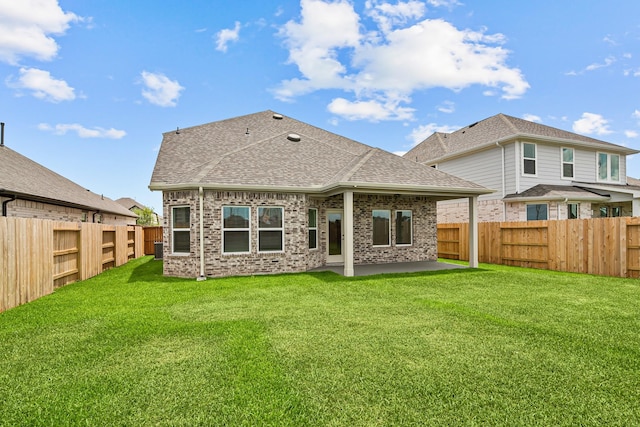 21734 Persian Lake Dr, Cypress, TX 77433 - rear view of house with roof with shingles, a patio, brick siding, and central AC