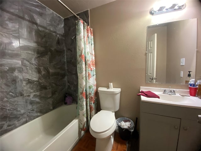 full bathroom featuring hardwood / wood-style floors, toilet, vanity, shower / bath combo, and a textured ceiling