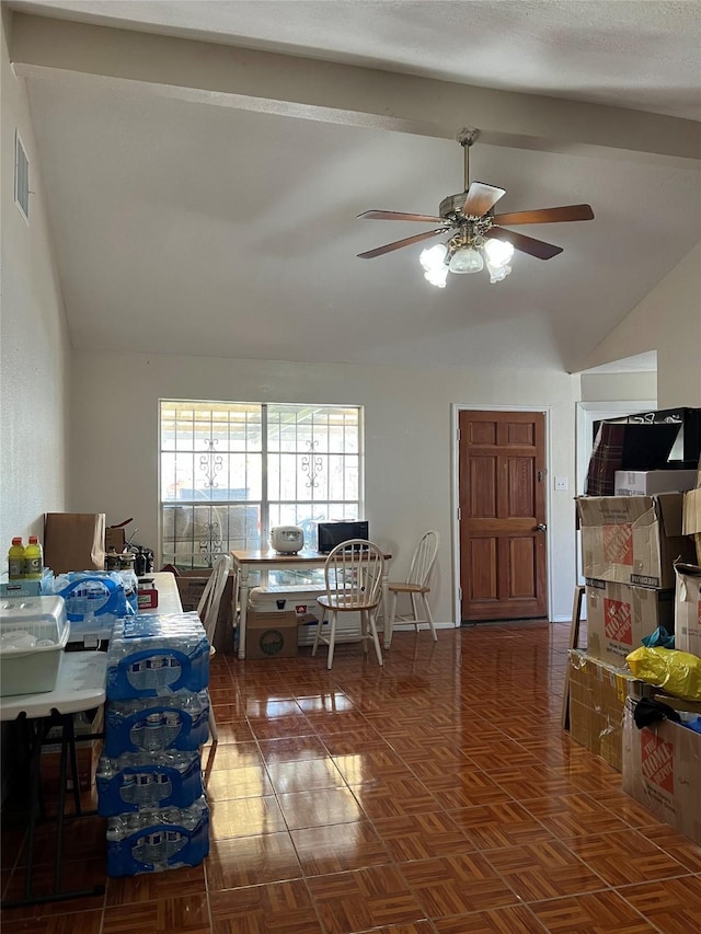 dining room featuring ceiling fan, lofted ceiling with beams, and dark parquet floors