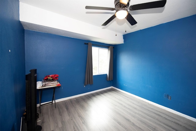 unfurnished room featuring ceiling fan and hardwood / wood-style floors