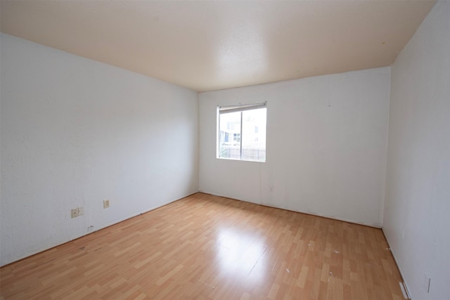 unfurnished room with light hardwood / wood-style flooring