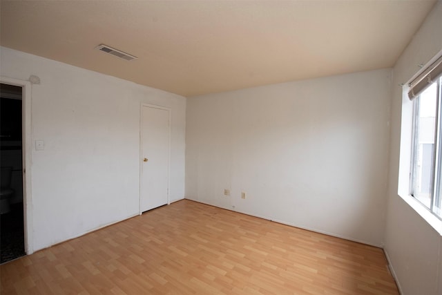 empty room with light hardwood / wood-style floors