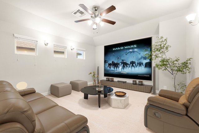 carpeted cinema featuring ceiling fan