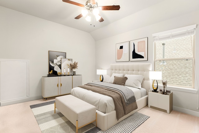 carpeted bedroom featuring ceiling fan and vaulted ceiling