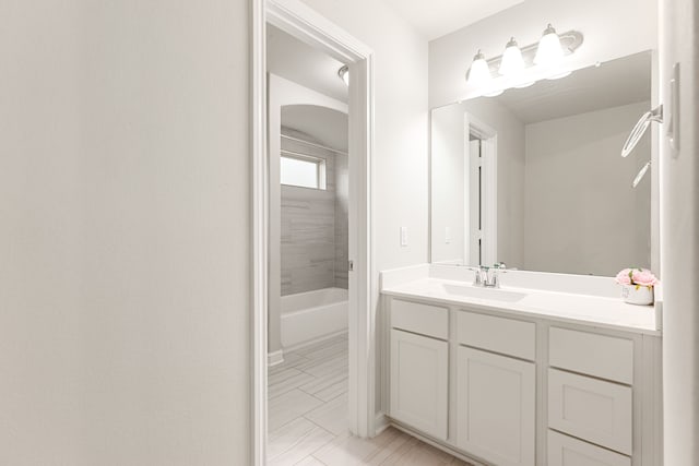 bathroom featuring vanity and bathing tub / shower combination