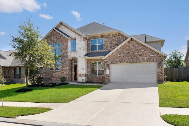 view of front of property featuring a garage and a front yard