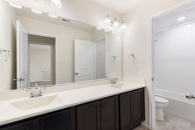 full bathroom with toilet, vanity, tile patterned flooring, and shower / bath combination