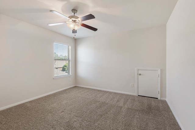 empty room featuring ceiling fan and carpet flooring