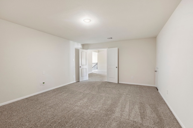 unfurnished room featuring carpet flooring