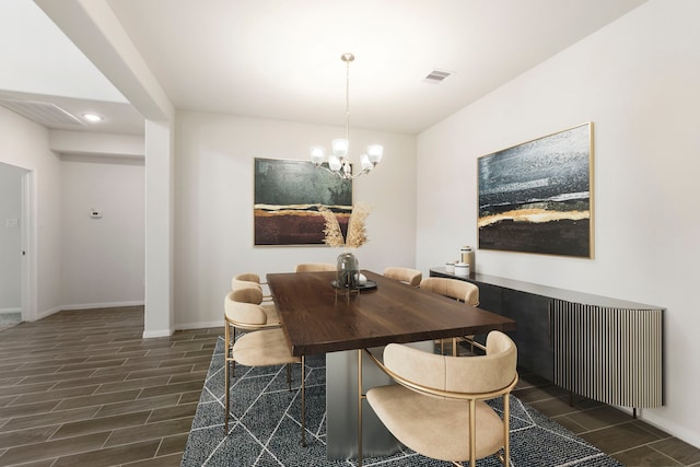 dining space with a chandelier