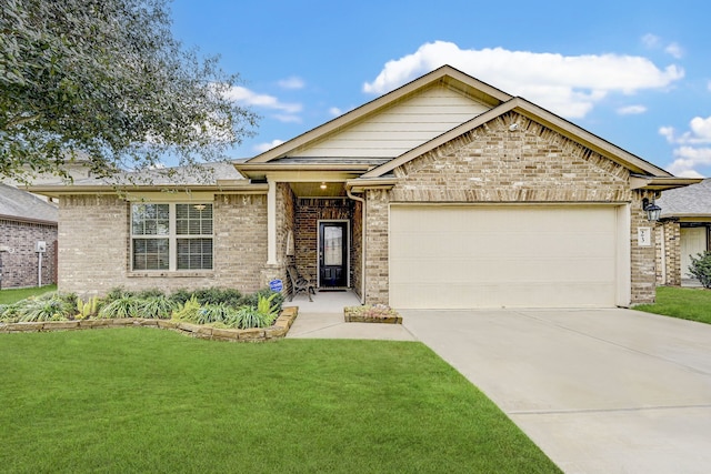 view of front of home featuring a front yard and a garage