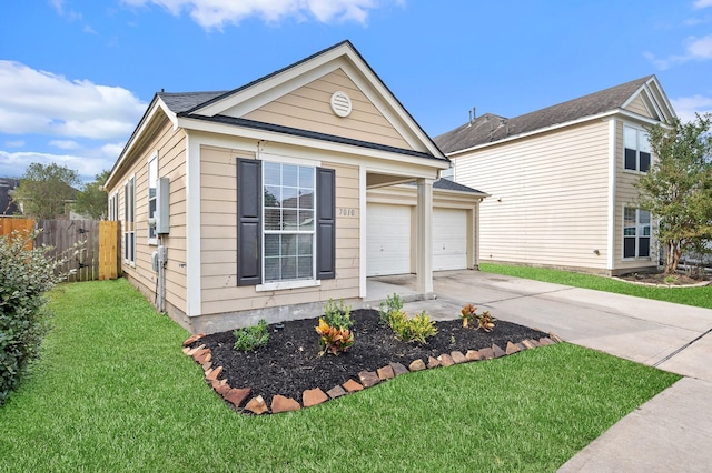 view of front of house with a front yard and a garage