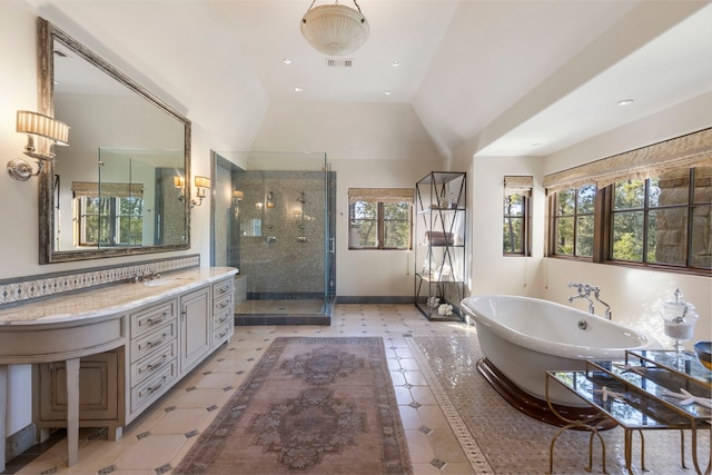 bathroom featuring vaulted ceiling, a wealth of natural light, vanity, and shower with separate bathtub