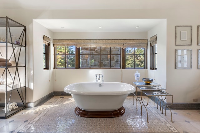 bathroom featuring a tub to relax in