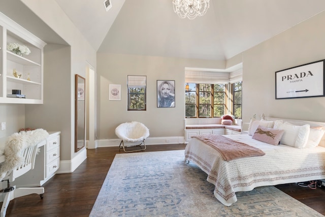 bedroom featuring lofted ceiling, dark wood-type flooring, and an inviting chandelier